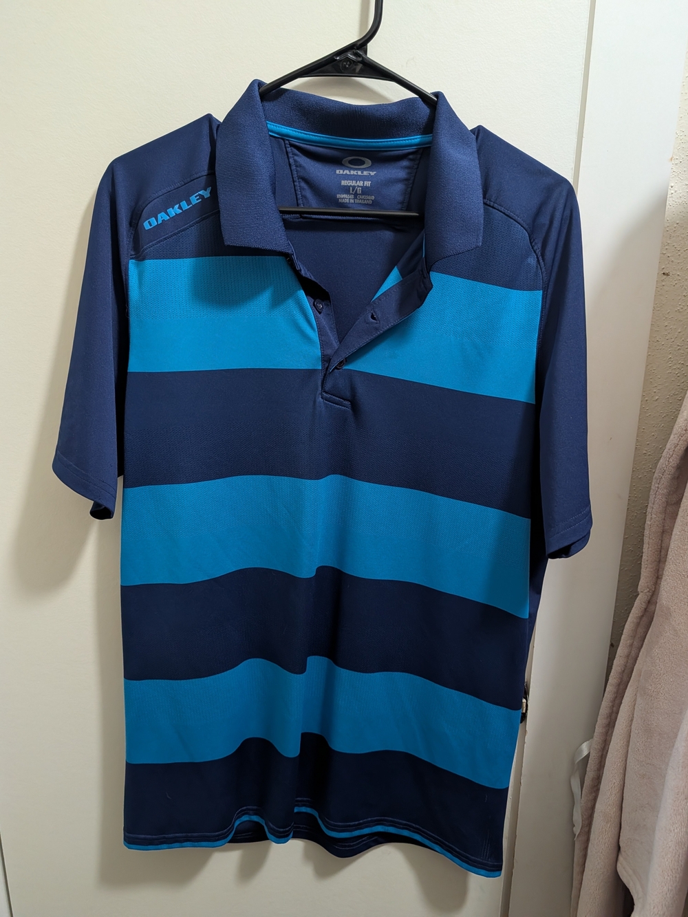 Oakley Men's Navy and Teal Wide-Stripe Polo
